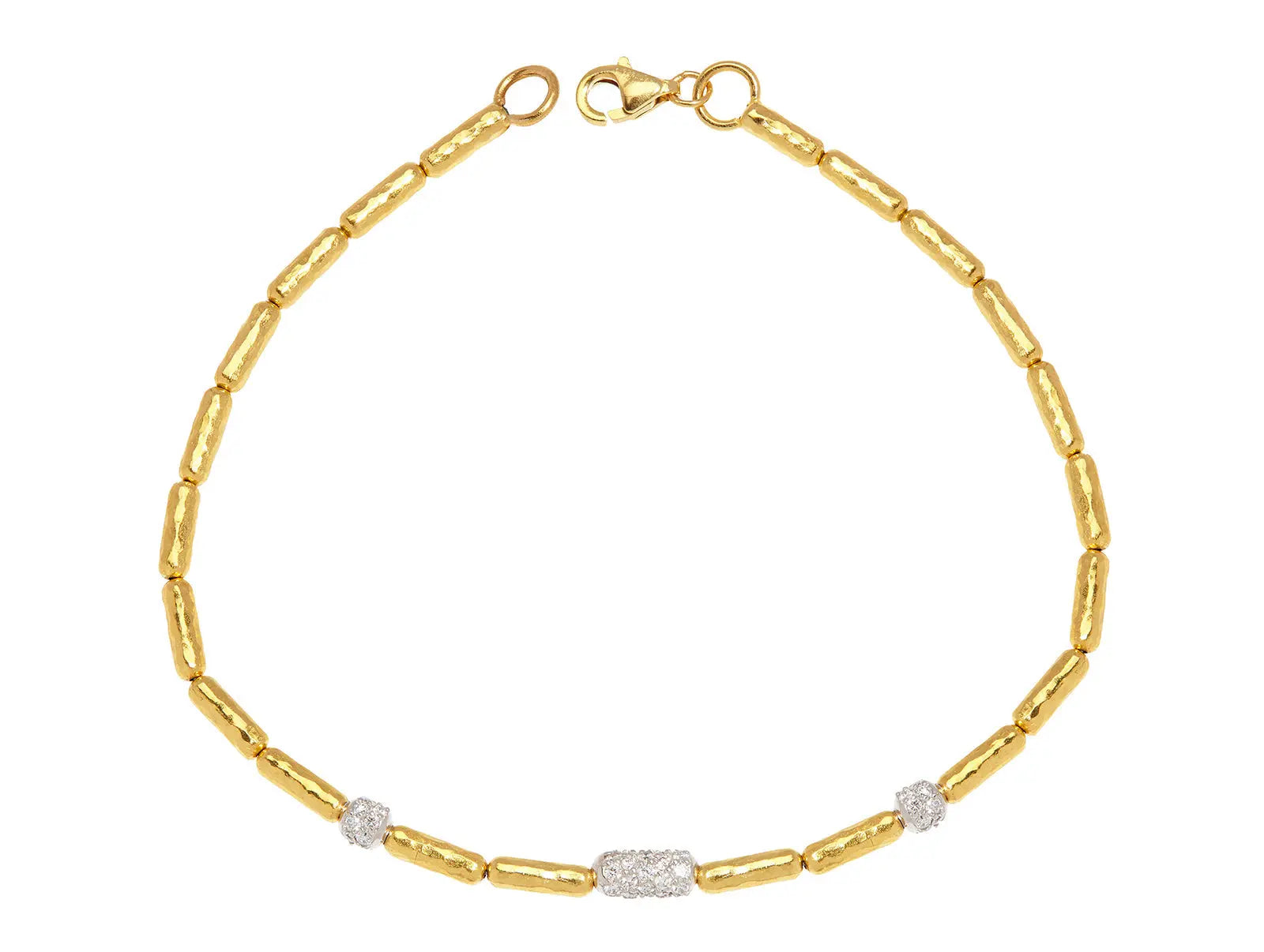 Gurhan Single Strand Bracelet from the Vertigo Collection. The bracelet is set in 24k yellow gold with the clasp in 22k yellow gold. The pave diamonds are set in 18k white gold. 3 pave diamonds in total with .50 cttw of diamonds. The length of the bracelet is 7.25 inches.