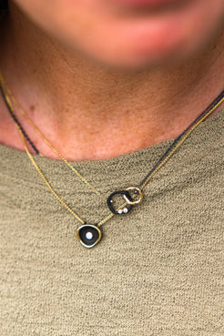 2 pendants with 18k yellow gold confluence and pebble