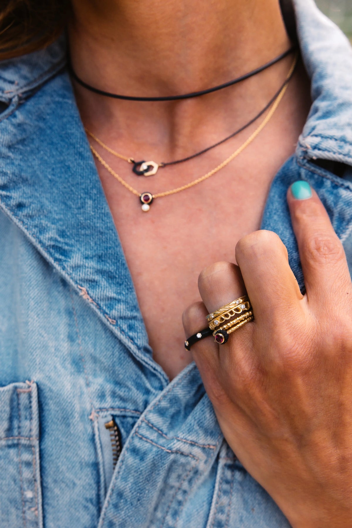 2 necklaces stacked with 18k yellow gold and a ruby pendant
