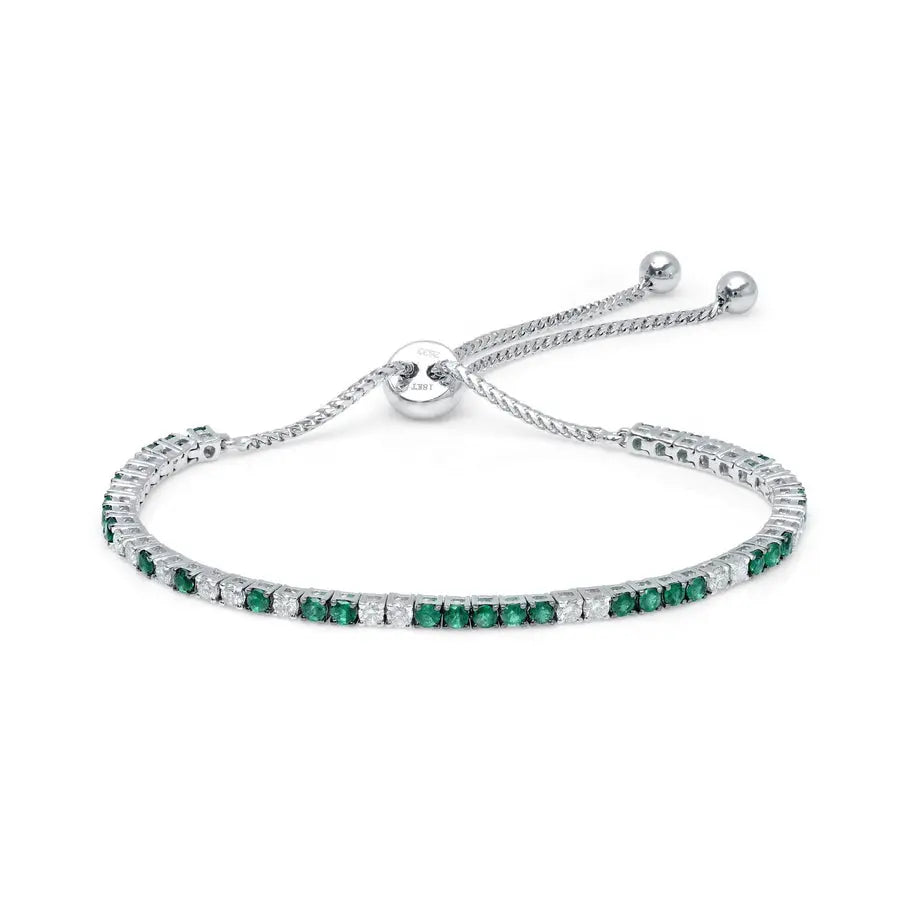 18K white gold with 1ct of emeralds and .60ct of brilliant white diamonds, 9&quot; and fully adjustable  Details:   Gemstone:  1 Carat of Emeralds, .60 Carat of G-H Color White Diamonds Metal: 18K Gold, 7 Grams Sizing: 9 Inches Fully Adjustable If item is out of stock, please allow for 4-6 weeks for delivery  Designed by Graziela Gems