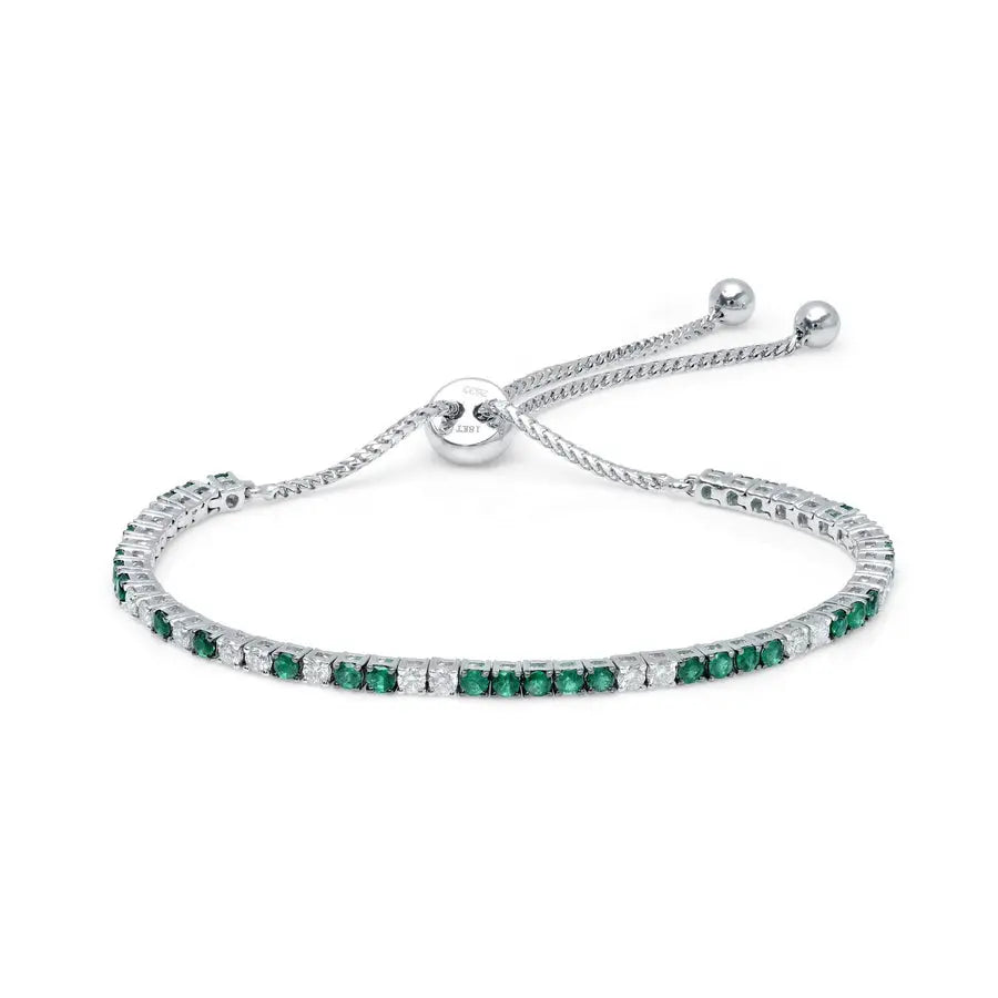 18K white gold with 1ct of emeralds and .60ct of brilliant white diamonds, 9" and fully adjustable  Details:   Gemstone:  1 Carat of Emeralds, .60 Carat of G-H Color White Diamonds Metal: 18K Gold, 7 Grams Sizing: 9 Inches Fully Adjustable If item is out of stock, please allow for 4-6 weeks for delivery  Designed by Graziela Gems