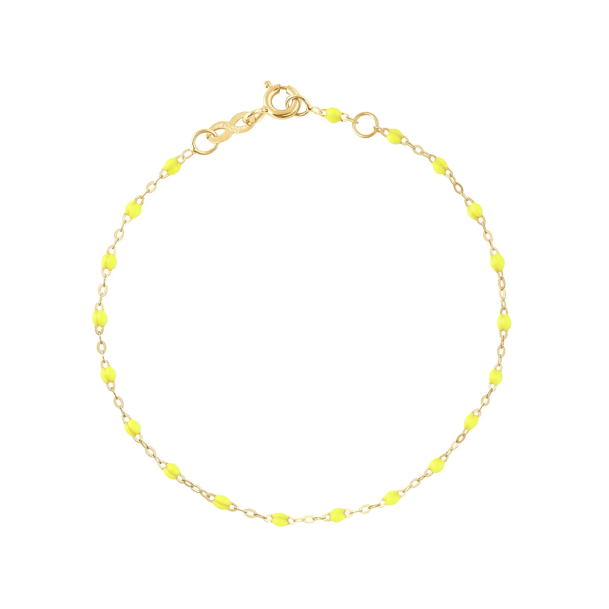 The Classic Gigi bracelet by gigi CLOZEAU features 18K Yellow Gold, and unique Lime jewels for a simple, everyday look.   Each jewel is unique, artisanally made in their family-owned workshop. 18K yellow gold and resin. The bracelet measures 6.7 inches with adjustable clasp at 6.3 inches.