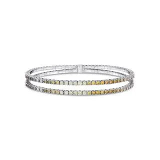 This is a stunning diamond tennis bracelet with 2 rows of naturally colored diamonds set in 18in white gold and 1.86 cttws of diamonds.    Designed by Meredith Young
