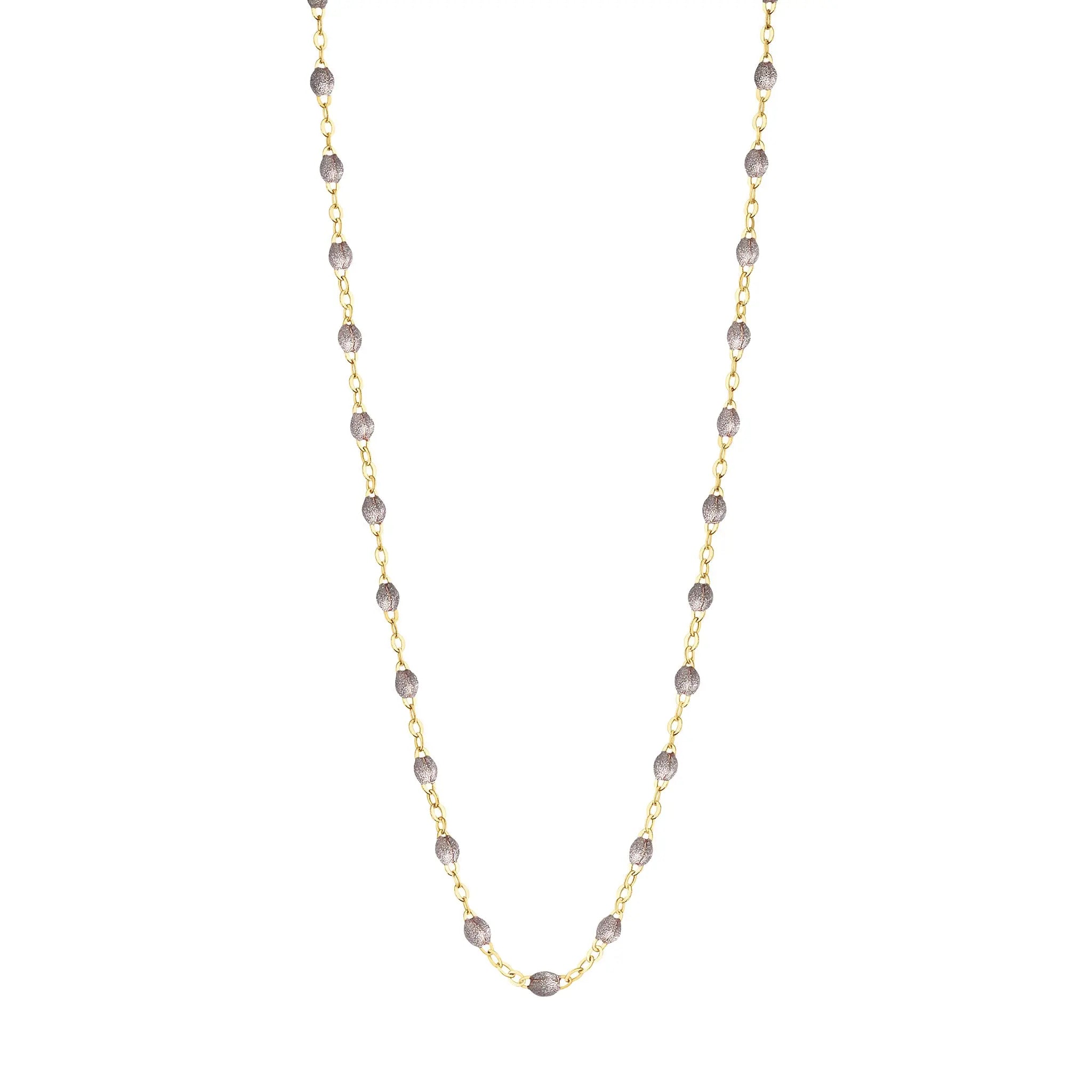 Stack you necklace layers with this versatile beaded chain! The Classic Gigi Necklace by gigi CLOZEAU features 18 carat yellow gold, and striking Silver resin jewels for an everyday effortless appearance. Handcrafted in 18k yellow gold. The beads measure 1.50mm in diameter and is finished with a spring ring clasp. The length is 16.5 inches.