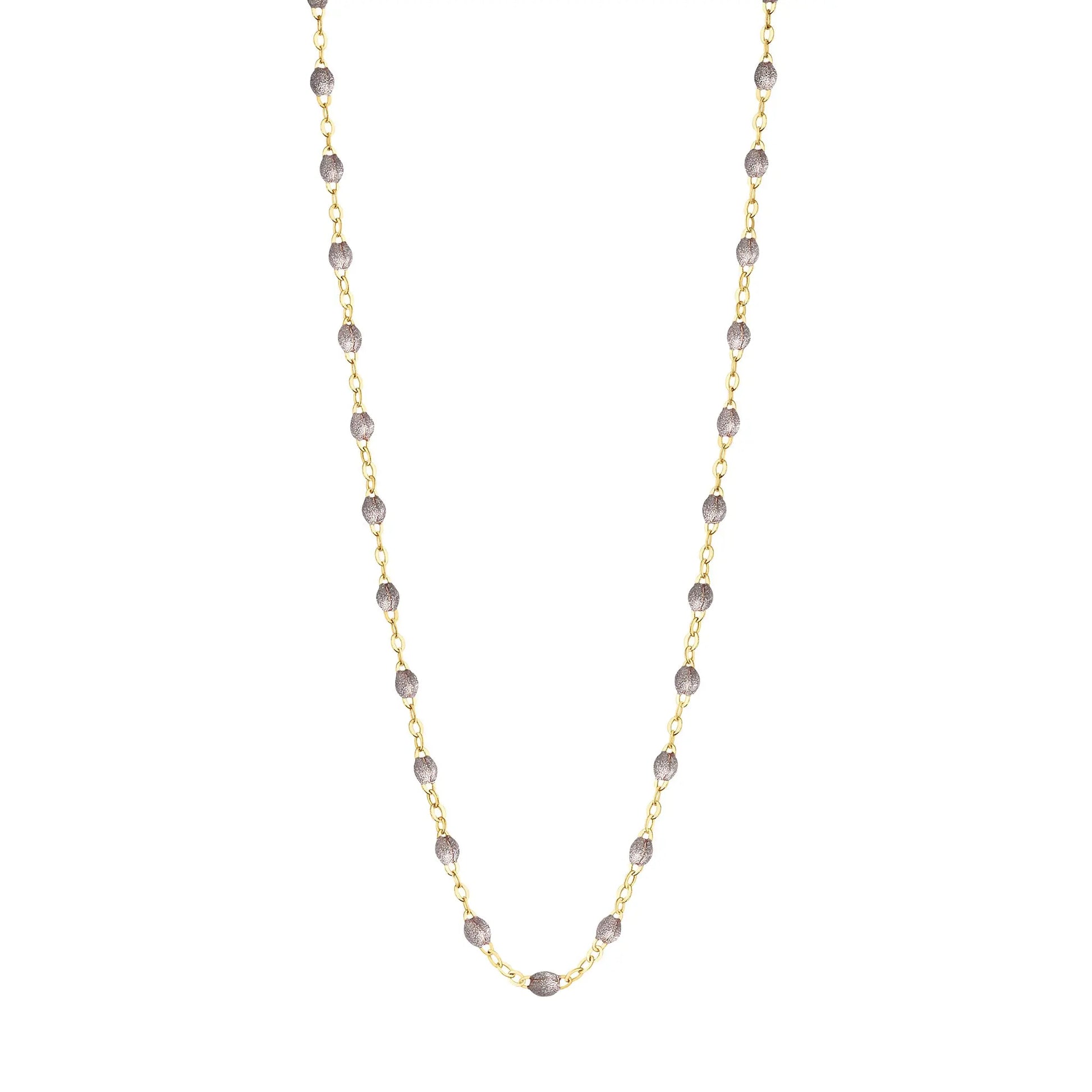 Stack you necklace layers with this versatile beaded chain! The Classic Gigi Necklace by gigi CLOZEAU features 18 carat yellow gold, and striking Silver resin jewels for an everyday effortless appearance. Handcrafted in 18k yellow gold. The beads measure 1.50mm in diameter and is finished with a spring ring clasp. The length is 16.5 inches.