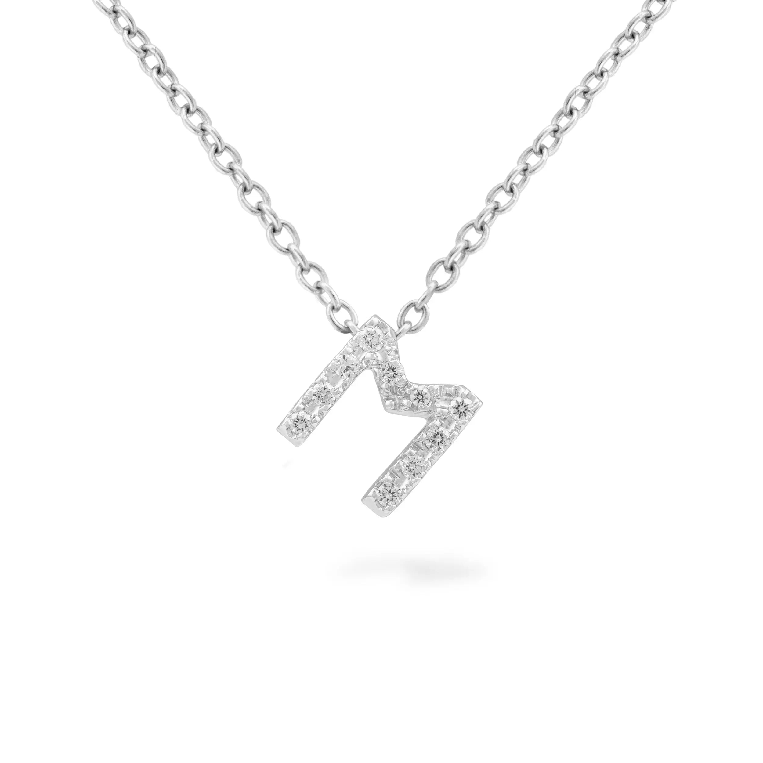 18K white gold necklace with letter pendant in white gold and diamonds .07 cttw  Length: 18 inches  If an item is out of stock, please allow 4-6 weeks for delivery  Designed by Piero Milano