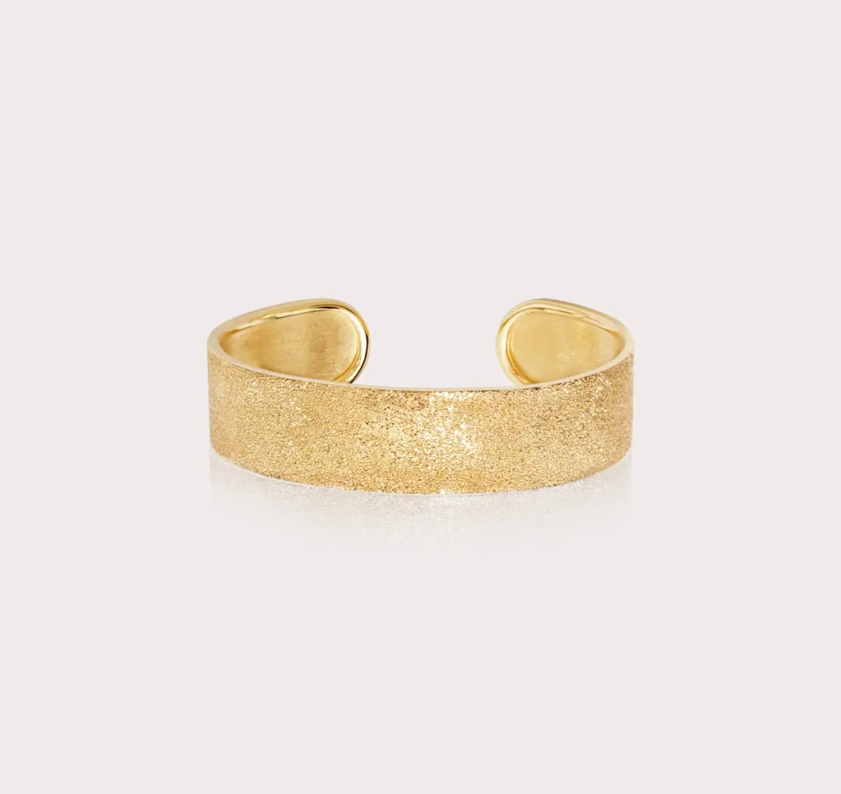 Florentine Finish is achieved by beating each piece with a diamond tipped tool, which leaves permanent faceted dents in the gold.   Made in 18k Yellow Gold, this rigid cuff measures 2 cm high.   Please note that as each product is made by hand, there may be slight natural variations in the length or tone of pieces.  Dimensions: 5 cm diameter   Designed by Carolina Bucci