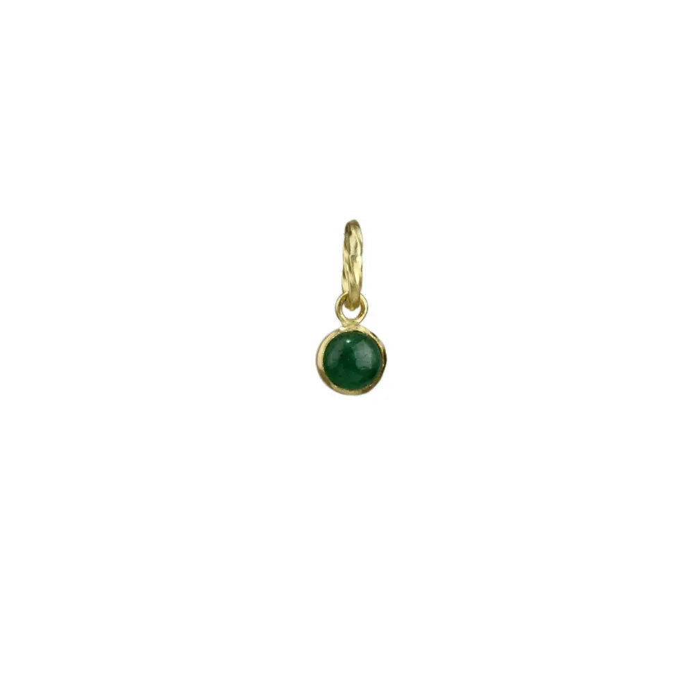 A 4mm emerald cabochon is bezel set in 18k gold and hangs from an 18k gold twisted bail.