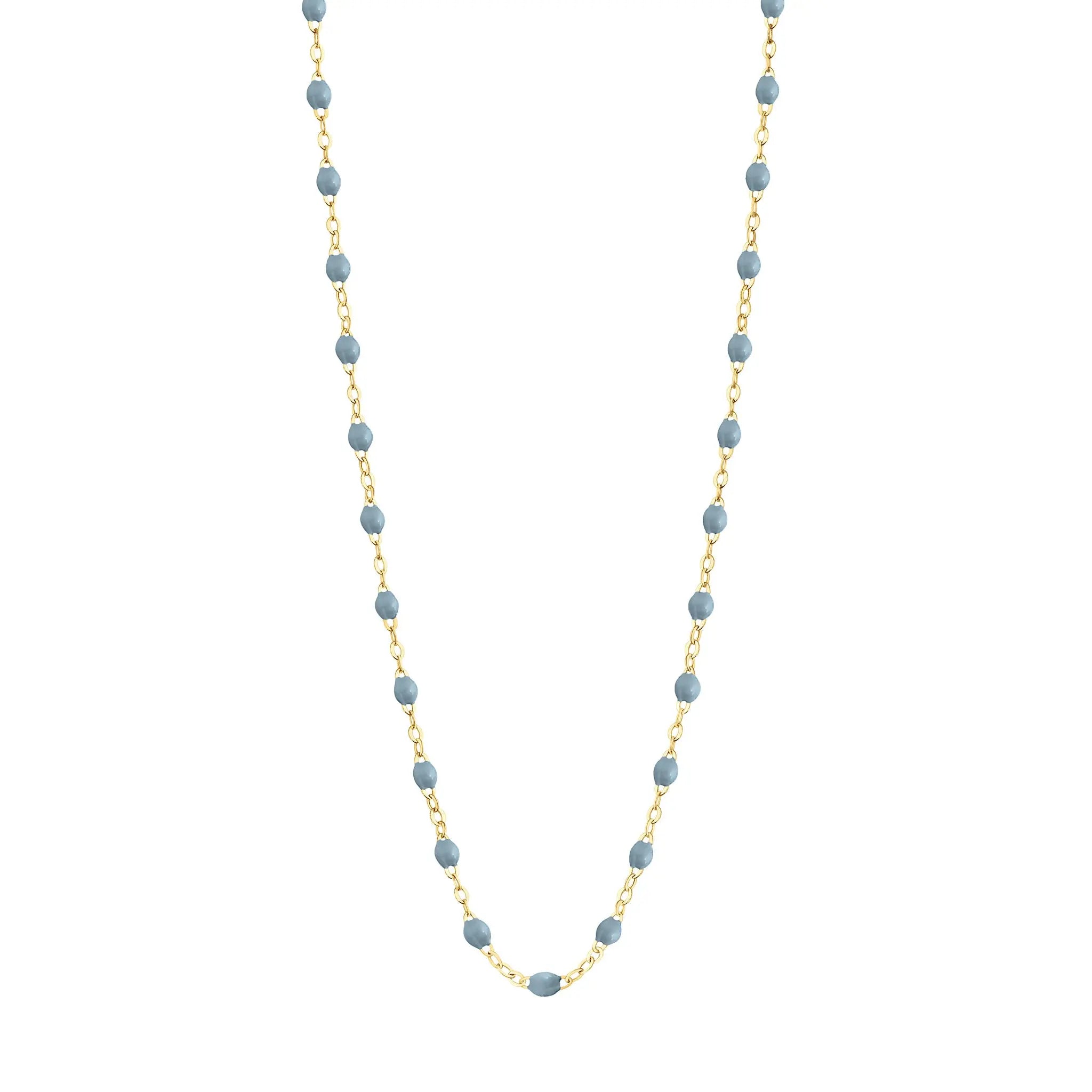 Stack you necklace layers with this versatile beaded chain! The Classic Gigi Necklace by gigi CLOZEAU features 18 carat yellow gold, and striking Jeans resin jewels for an everyday effortless appearance. Handcrafted in 18k yellow gold. The beads measure 1.50mm in diameter and is finished with a spring ring clasp. The length is 16.5 inches.