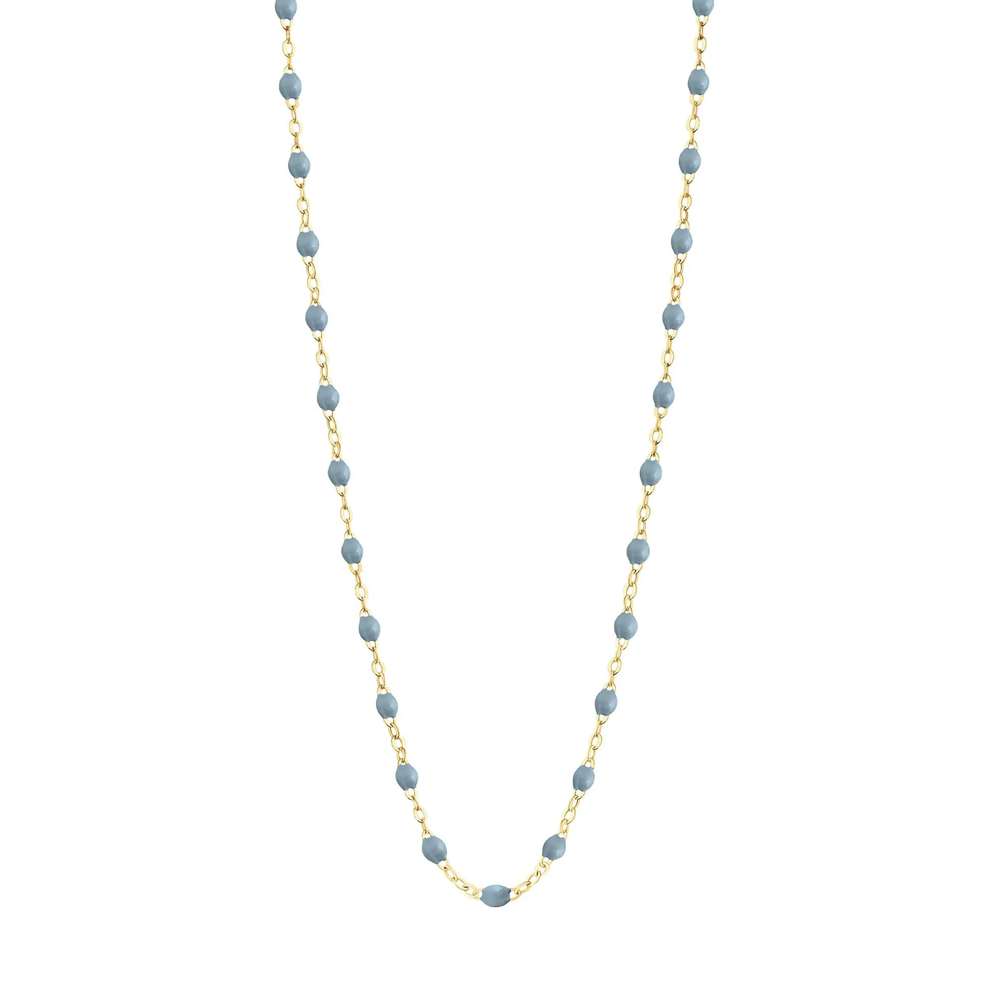 Stack you necklace layers with this versatile beaded chain! The Classic Gigi Necklace by gigi CLOZEAU features 18 carat yellow gold, and striking Jeans resin jewels for an everyday effortless appearance. Handcrafted in 18k yellow gold. The beads measure 1.50mm in diameter and is finished with a spring ring clasp. The length is 16.5 inches.
