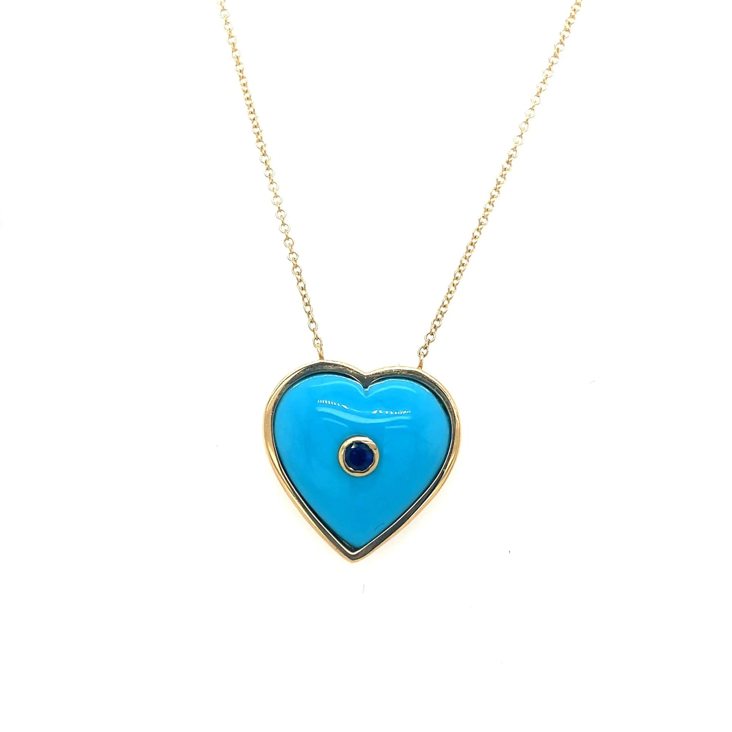 A played nod to the latest trend, hearts. Brent Neale created this puff birthstone heart pendant with blue sapphires. This piece is set in 18k yellow gold and is on an 18 inch chain.   Designed by Brent Neale and made in New York