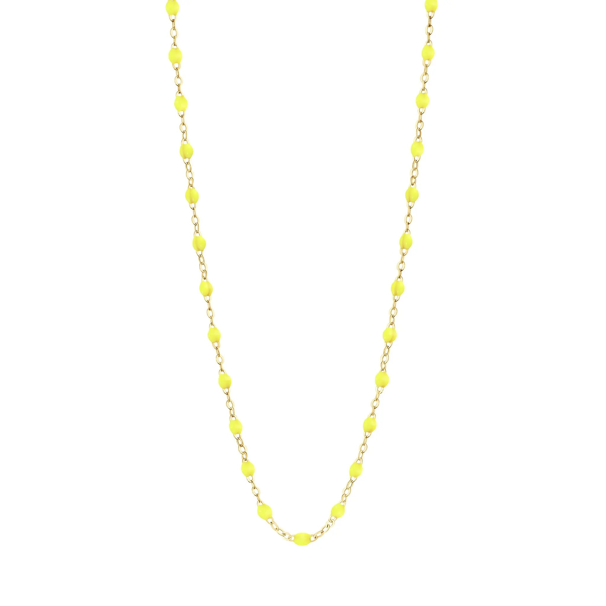 Stack you necklace layers with this versatile beaded chain! The Classic Gigi Necklace by gigi CLOZEAU features 18 carat yellow gold, and striking Lime resin jewels for an everyday effortless appearance. Handcrafted in 18k yellow gold. The beads measure 1.50mm in diameter and is finished with a spring ring clasp. The length is 16.5 inches.