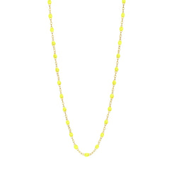 Stack you necklace layers with this versatile beaded chain! The Classic Gigi Necklace by gigi CLOZEAU features 18 carat yellow gold, and striking Lime resin jewels for an everyday effortless appearance. Handcrafted in 18k yellow gold. The beads measure 1.50mm in diameter and is finished with a spring ring clasp. The length is 16.5 inches.