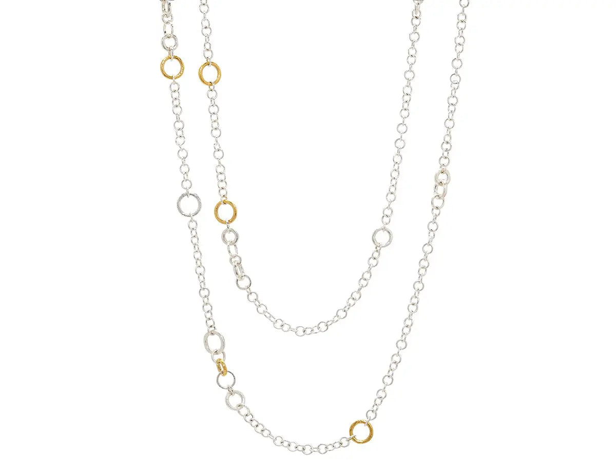 Mixed link Hoopla necklace in sterling silver layered with 24K gold featuring mixed-sized round links, with 5 gold links. The total length is 39.5" total length with a handmade lobster clasp.  Designed by Gurhan