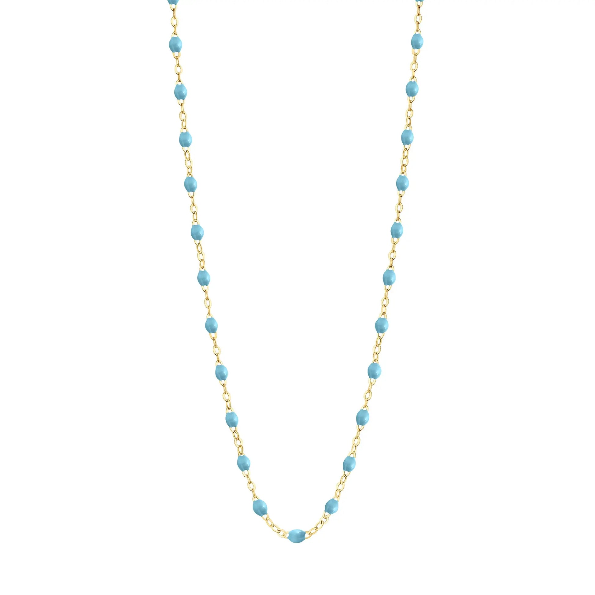 Stack you necklace layers with this versatile beaded chain! The Classic Gigi Necklace by gigi CLOZEAU features 18 carat yellow gold, and striking Turquoise resin jewels for an everyday effortless appearance. Handcrafted in 18k yellow gold. The beads measure 1.50mm in diameter and is finished with a spring ring clasp. The length is 16.5 inches.