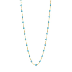 Stack you necklace layers with this versatile beaded chain! The Classic Gigi Necklace by gigi CLOZEAU features 18 carat yellow gold, and striking Turquoise resin jewels for an everyday effortless appearance. Handcrafted in 18k yellow gold. The beads measure 1.50mm in diameter and is finished with a spring ring clasp. The length is 19.7 inches.