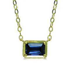 Leone Sapphire NecklaceOur classic east-west set emerald cut blue sapphire radiates a soothing blue shade for that perfect pop of color on your neckline.  14K sustainable gold 0.65ct emerald cut blue sapphire 16" chain with 15" option, lobster clasp closure  Dimensions:  1/3" x 1/4"  Designed by ILA