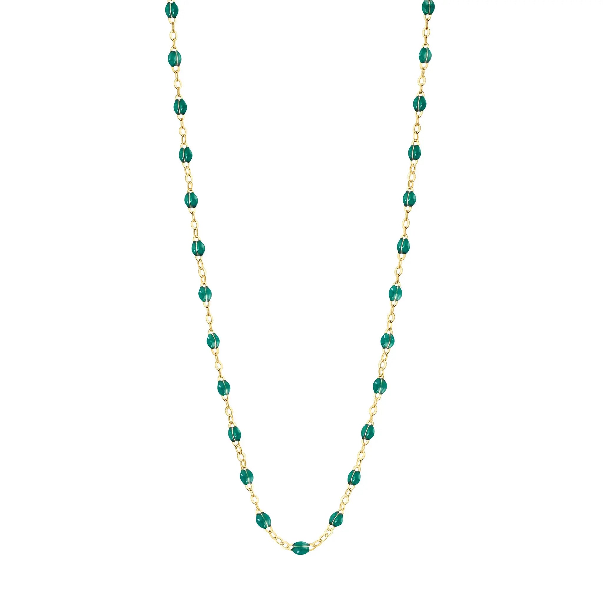 Stack you necklace layers with this versatile beaded chain! The Classic Gigi Necklace by gigi CLOZEAU features 18 carat yellow gold, and striking Emerald resin jewels for an everyday effortless appearance. Handcrafted in 18k yellow gold. The beads measure 1.50mm in diameter and is finished with a spring ring clasp. The length is 16.5 inches.
