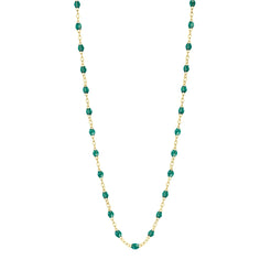 Stack you necklace layers with this versatile beaded chain! The Classic Gigi Necklace by gigi CLOZEAU features 18 carat yellow gold, and striking Emerald resin jewels for an everyday effortless appearance. Handcrafted in 18k yellow gold. The beads measure 1.50mm in diameter and is finished with a spring ring clasp. The length is 16.5 inches.
