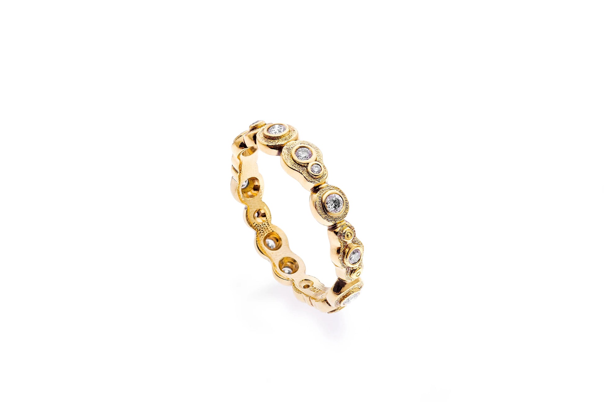 Alex Sepkus begins with a wax model, which is eventually cast in 18kt gold, or platinum, and then hand-finished. The band is great on its own or stacked. It is set in 18K Yellow Gold with Diamonds .34 cttw. The band width is 4mm. The ring size is 6.5. If you need a different size, please email shop@sbvail.com.