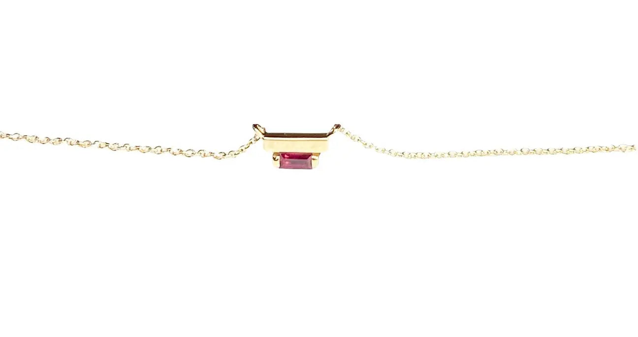 The Ladder Climber Necklace perfectly compliments our Ladder Climber earrings.  4x2mm ruby baguette suspended under a solid 18k recycled gold bar.  4x2mm ruby baguette Total carat weight: 0.13 18K recycled yellow gold Designed by Alex Fitz