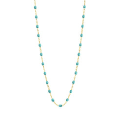 Stack you necklace layers with this versatile beaded chain! The Classic Gigi Necklace by gigi CLOZEAU features 18 carat yellow gold, and striking Turquoise Green resin jewels for an everyday effortless appearance. Handcrafted in 18k yellow gold. The beads measure 1.50mm in diameter and is finished with a spring ring clasp. The length is 19.7 inches.