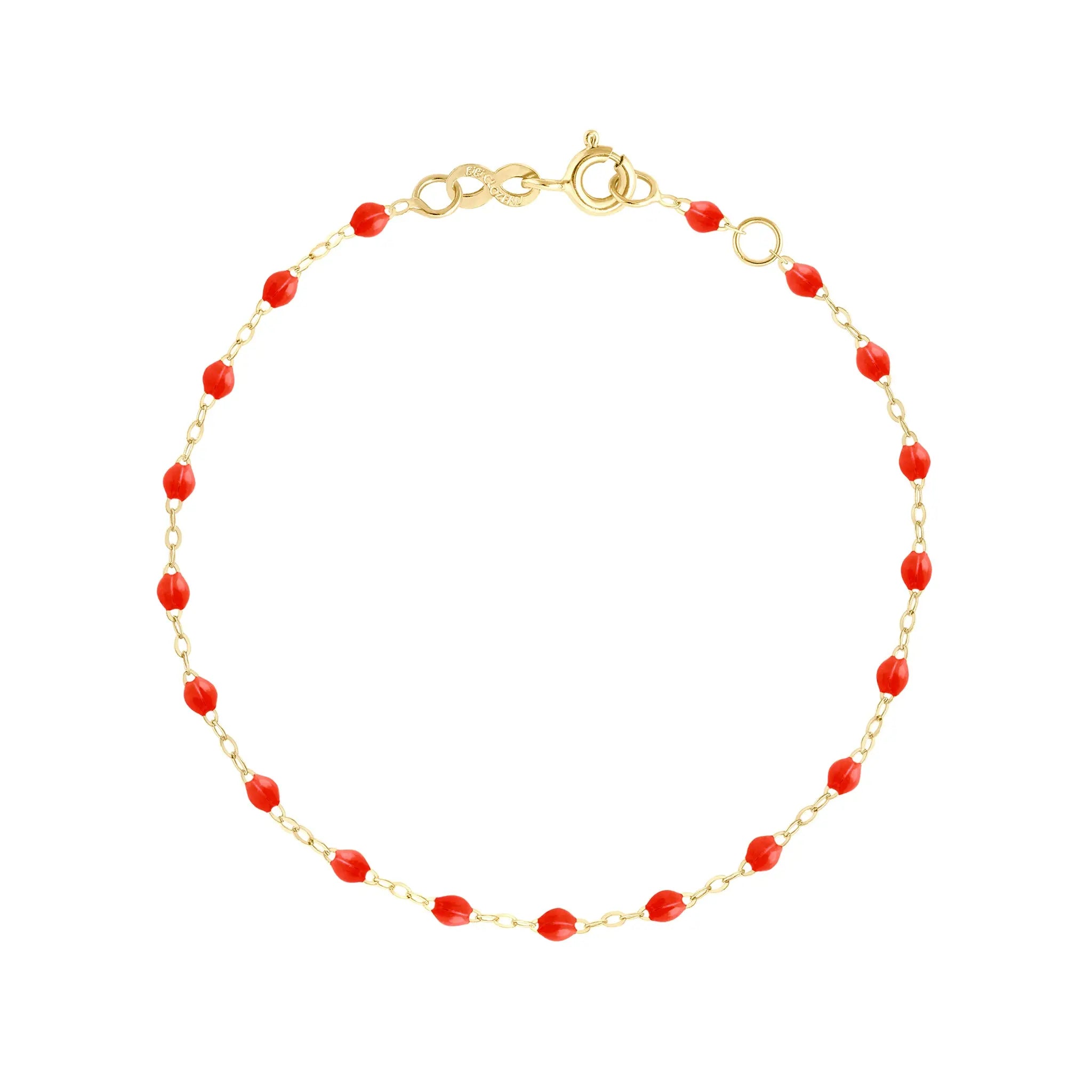 The Classic Gigi bracelet by gigi CLOZEAU features 18K Yellow Gold, and unique Coral jewels for a simple, everyday look.   Each jewel is unique, artisanally made in their family-owned workshop. 18K yellow gold and resin. The bracelet measures 6.7 inches with adjustable clasp at 6.3 inches.