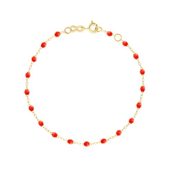 The Classic Gigi bracelet by gigi CLOZEAU features 18K Yellow Gold, and unique Coral jewels for a simple, everyday look.   Each jewel is unique, artisanally made in their family-owned workshop. 18K yellow gold and resin. The bracelet measures 6.7 inches with adjustable clasp at 6.3 inches.
