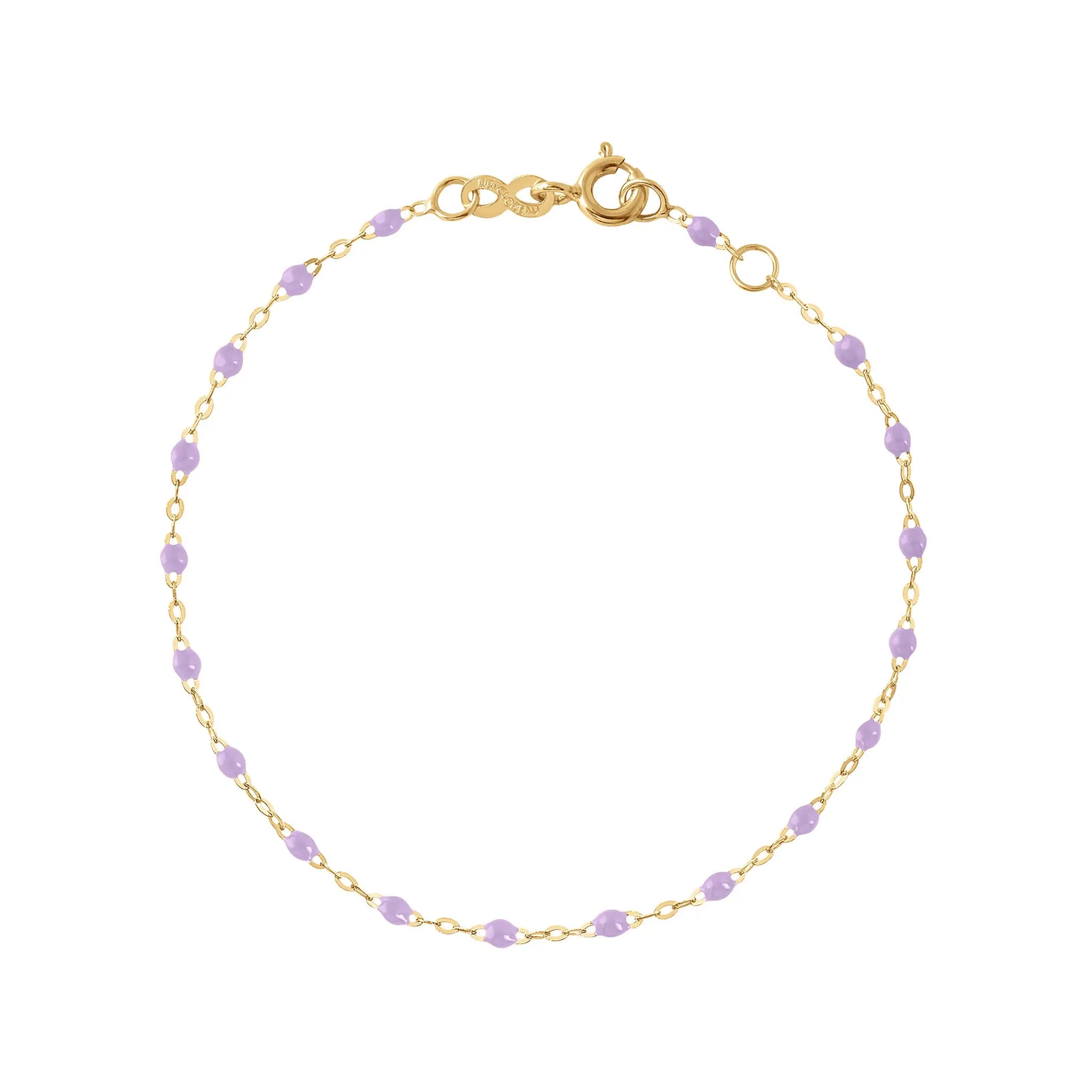 The Classic Gigi bracelet by gigi CLOZEAU features 18K Yellow Gold, and unique Lilac jewels for a simple, everyday look.   Each jewel is unique, artisanally made in their family-owned workshop. 18K yellow gold and resin. The bracelet measures 6.7 inches with adjustable clasp at 6.3 inches.