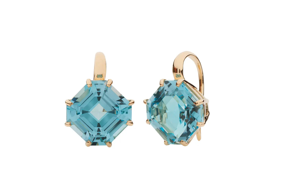 Gold earrings with blue topaz stones.
