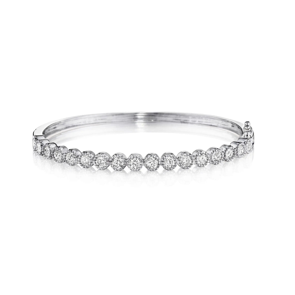 This a classic bangle that needs to be in your collection. It is 18k white gold with 1.80 cttw of round bezel brilliant cut diamond bangle.   Designed by Penny Preville and made in New York