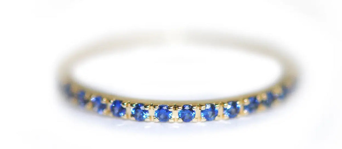ETERNITY BAND WITH LARGE BLUE SAPPHIRE - Squash Blossom Vail