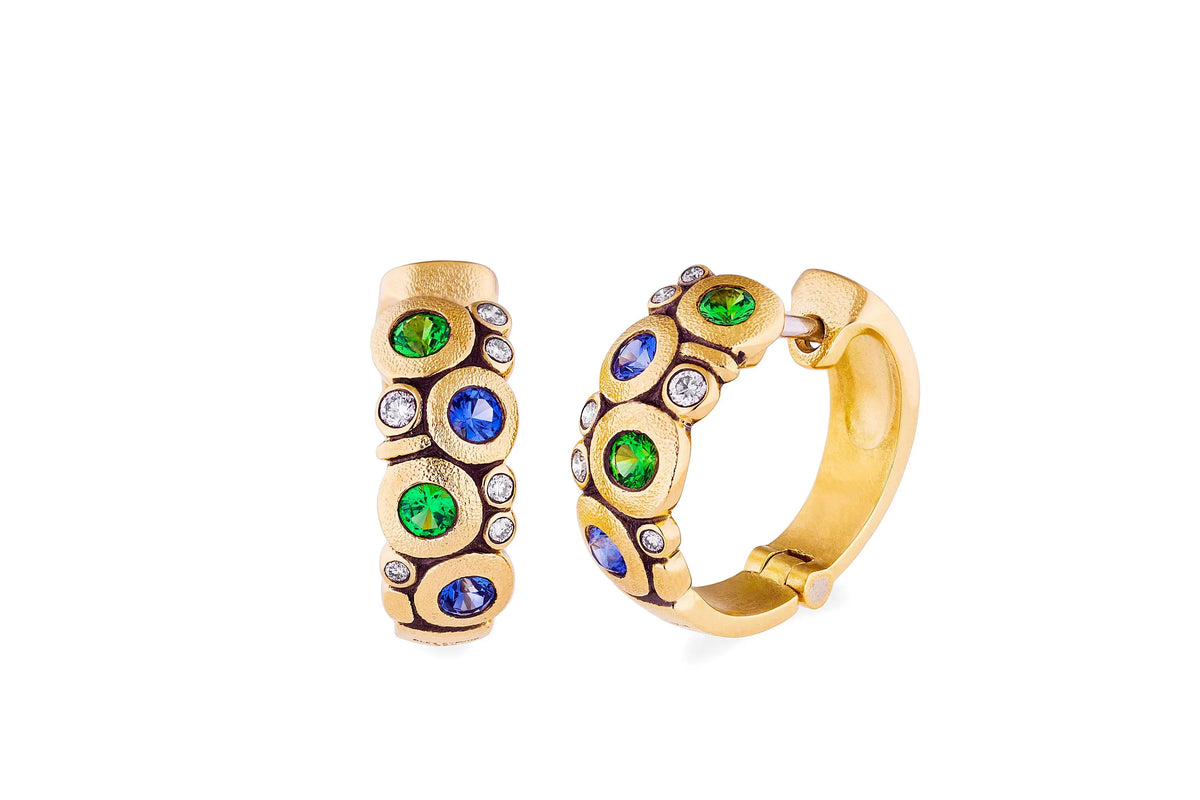 The candy huggies is so amazing. It is 18k yellow gold with 8 sapphires/tsavorites, and 12 diamonds  Details: Blue Sapphire/Tsavorite .56ct and Diamonds .20ct designed by Alex Sepkus and made in NYC