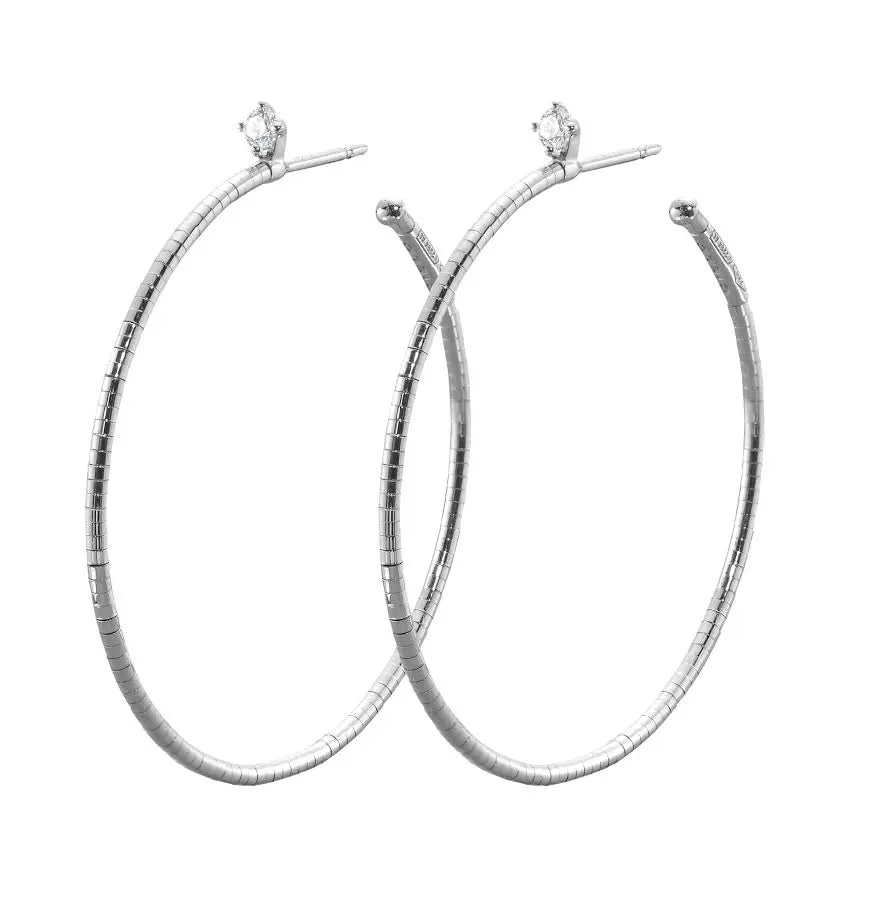 18k white gold earrings with .15cttw of white, brilliant cut diamonds.  Post back closure.  If an item is out of stock, please allow 3-6 weeks for delivery.    Designed by Mattia Cielo and made in Italy