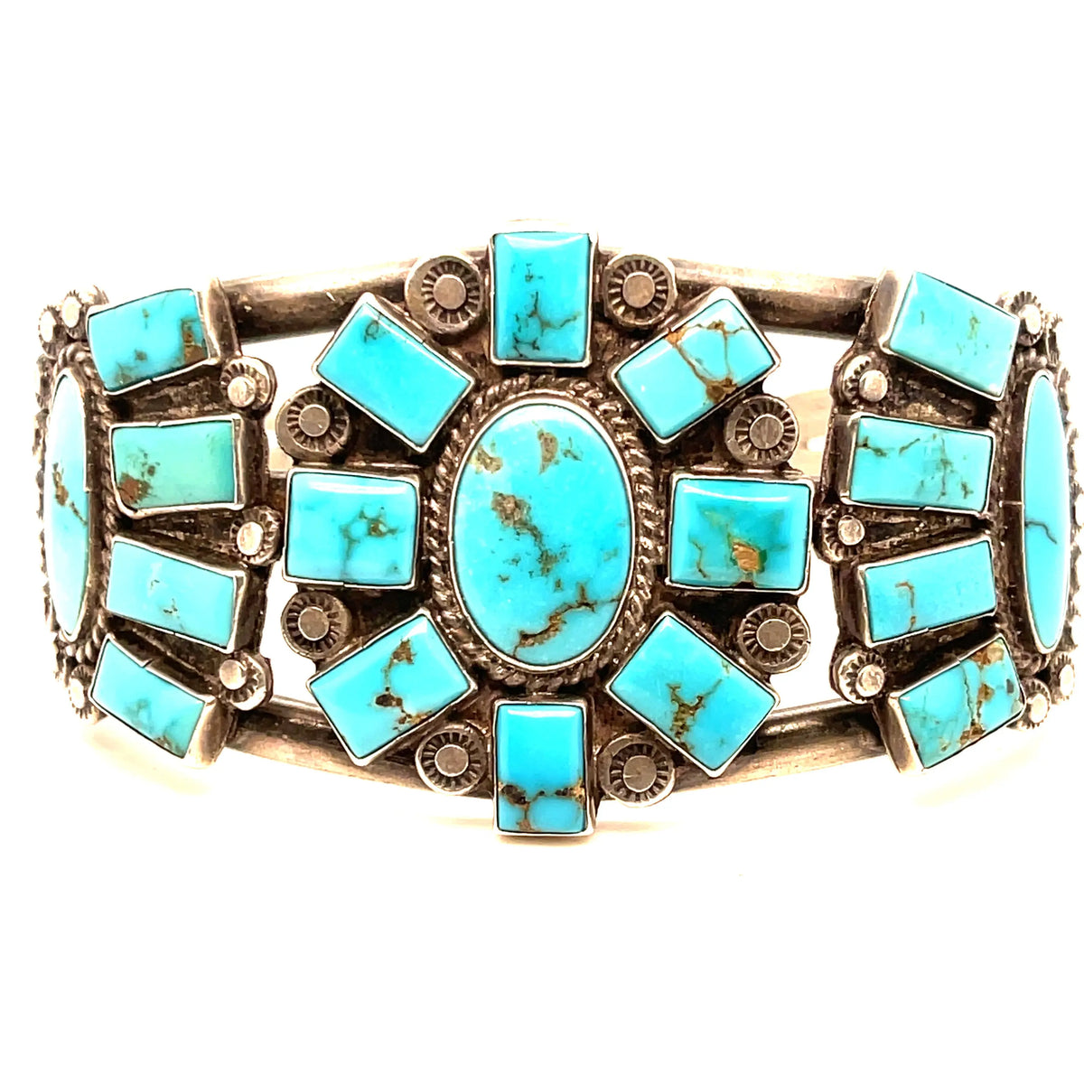 1930s Vintage Sterling Silver Blue Gem Turquoise Bracelet with 19 pieces of Turquoise  Dimensions: openning 1.2in and cirmunference 2.5in  NOTE: Please bear that in mind that, when you purchase vintage, it might not be perfect, but it will be authentic. Please contact shop@sbvail.com if you have additional questions about the nature and condition of the product.