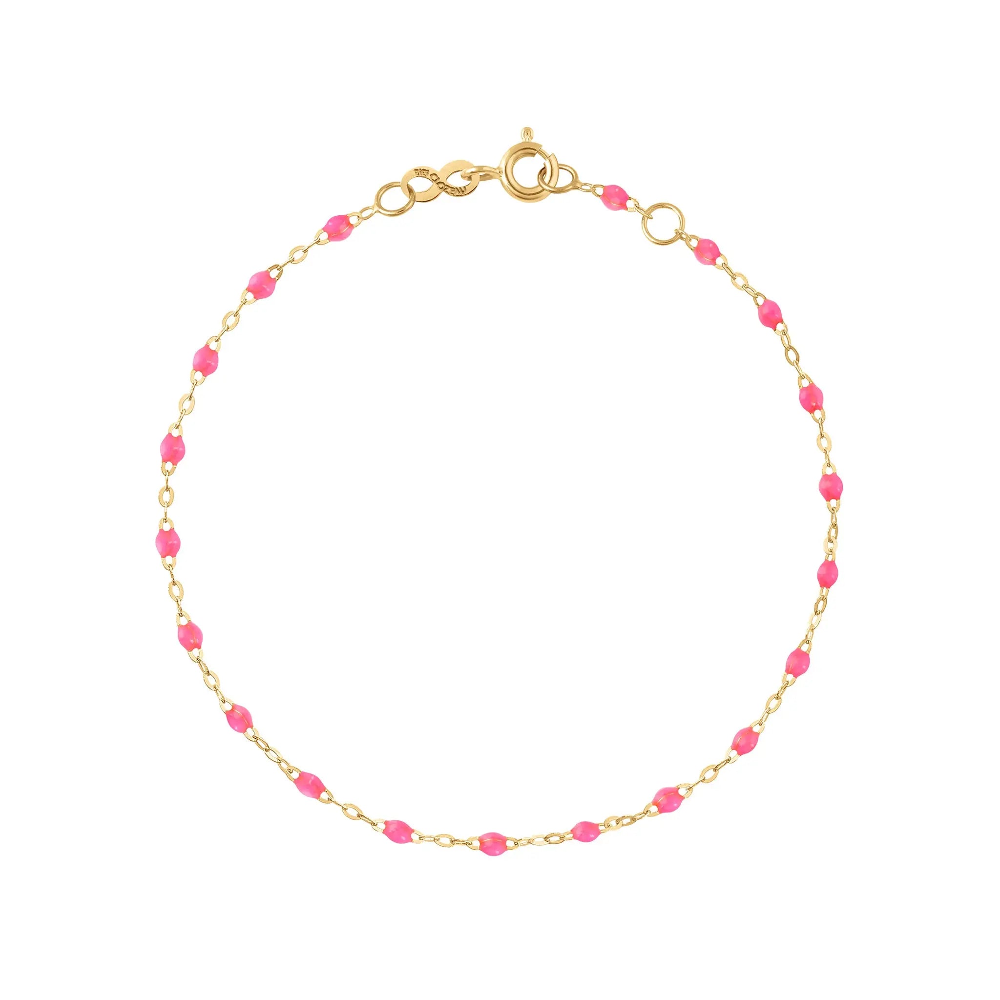 The Classic Gigi bracelet by gigi CLOZEAU features 18K Yellow Gold, and unique Pink jewels for a simple, everyday look.   Each jewel is unique, artisanally made in their family-owned workshop. 18K yellow gold and resin. The bracelet measures 6.7 inches with adjustable clasp at 6.3 inches.