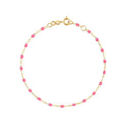 The Classic Gigi bracelet by gigi CLOZEAU features 18K Yellow Gold, and unique Pink jewels for a simple, everyday look.   Each jewel is unique, artisanally made in their family-owned workshop. 18K yellow gold and resin. The bracelet measures 6.7 inches with adjustable clasp at 6.3 inches.