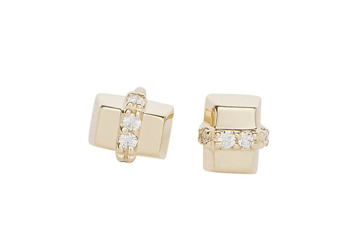 You'll be wearing these incredible studs all day every day. The sparkliest of diamonds nestled on each side of a high polish gold bar.   Ethically sourced round and baguette diamonds .58 total carat weight Recycled 18K yellow gold Double notch recycled 18K post for added security Designed by Alex Fitz