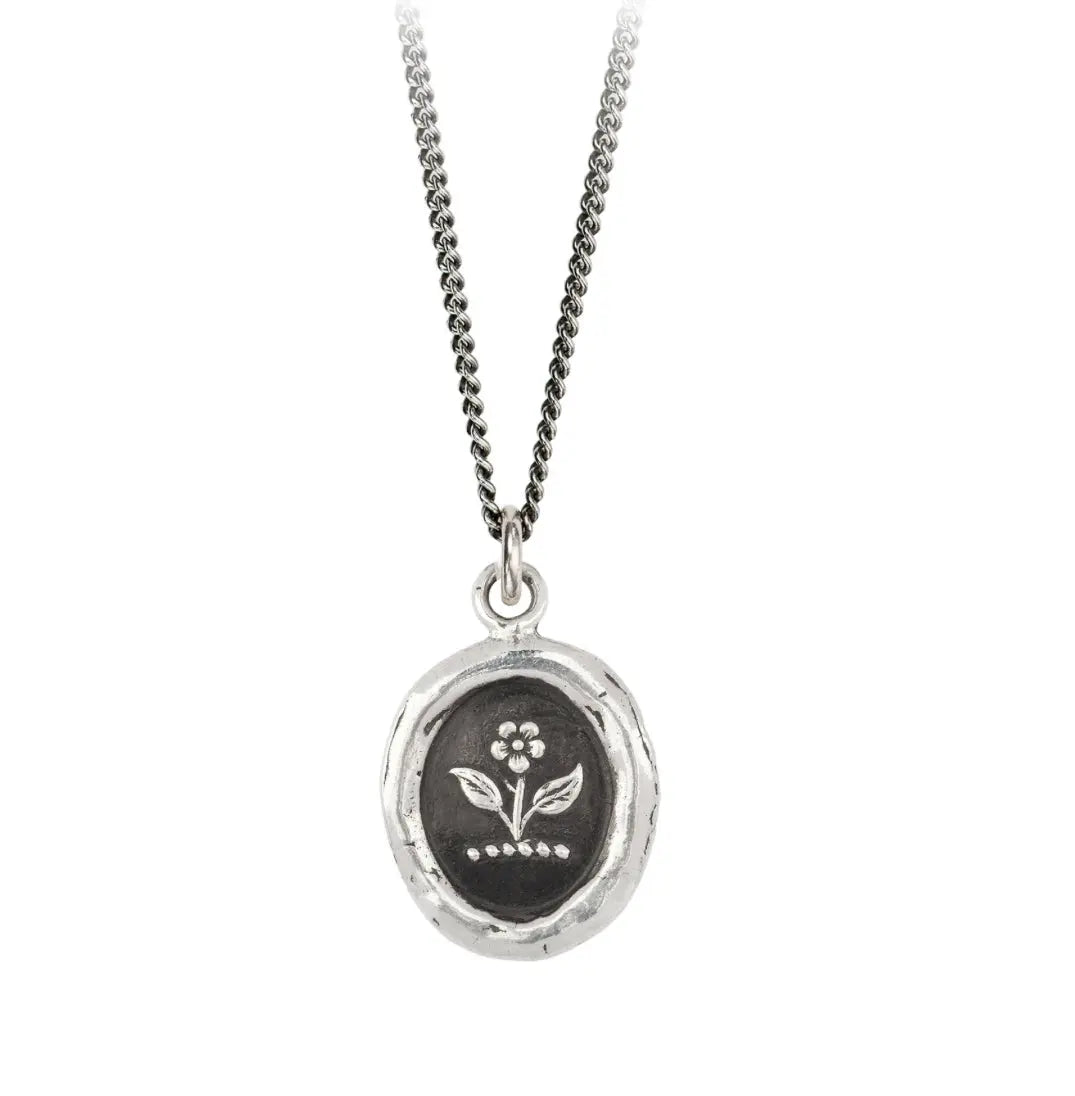 This talisman features a rose pictured with its stalk, symbolic of strength and beauty.  Handcrafted in Vancouver, Canada Cast in 100% recycled sterling silver or bronze Sterling silver chain 18 inches and lobster clasp with Pyrrha branded quality tag Meaning card (handmade from recycled materials)