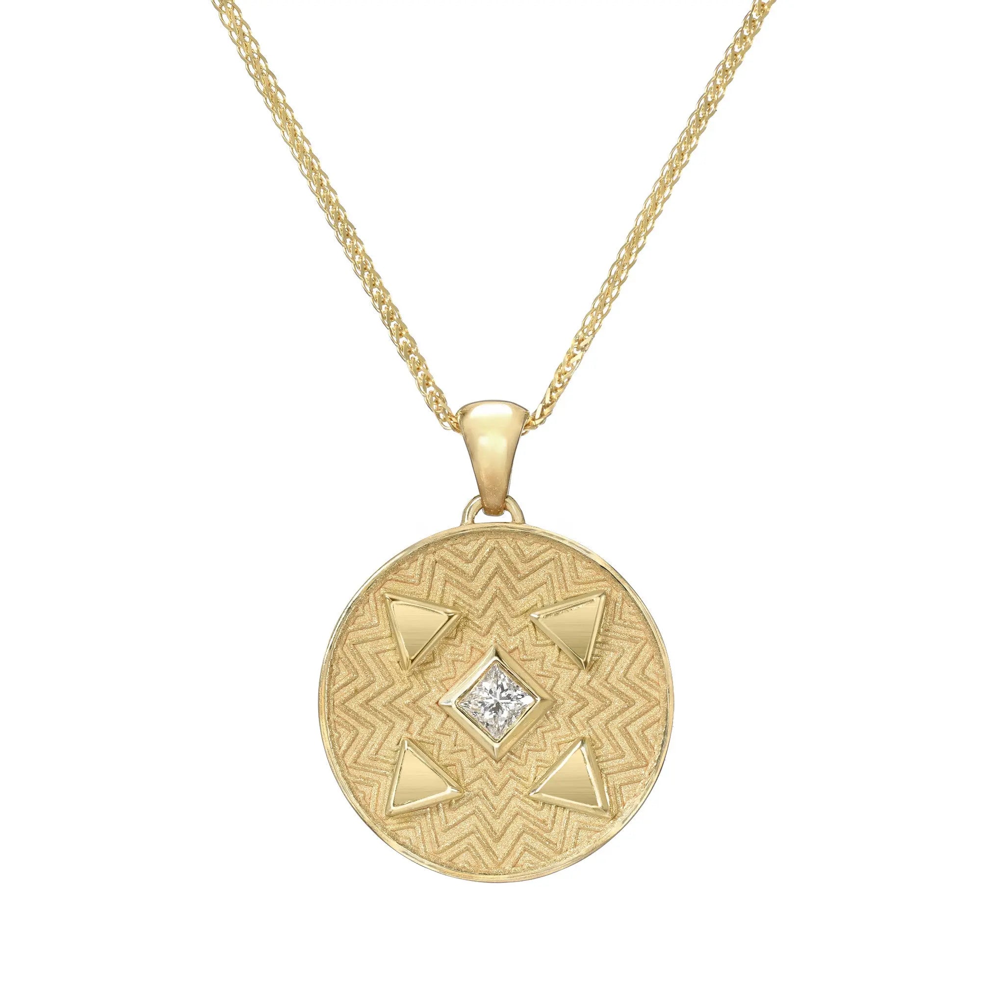Vibrant texture and bezels extend from the center of this medallion. This piece is a mix of matte and high polish and has "Pure Energy"  engraved on the back. Designed my Meredith Young