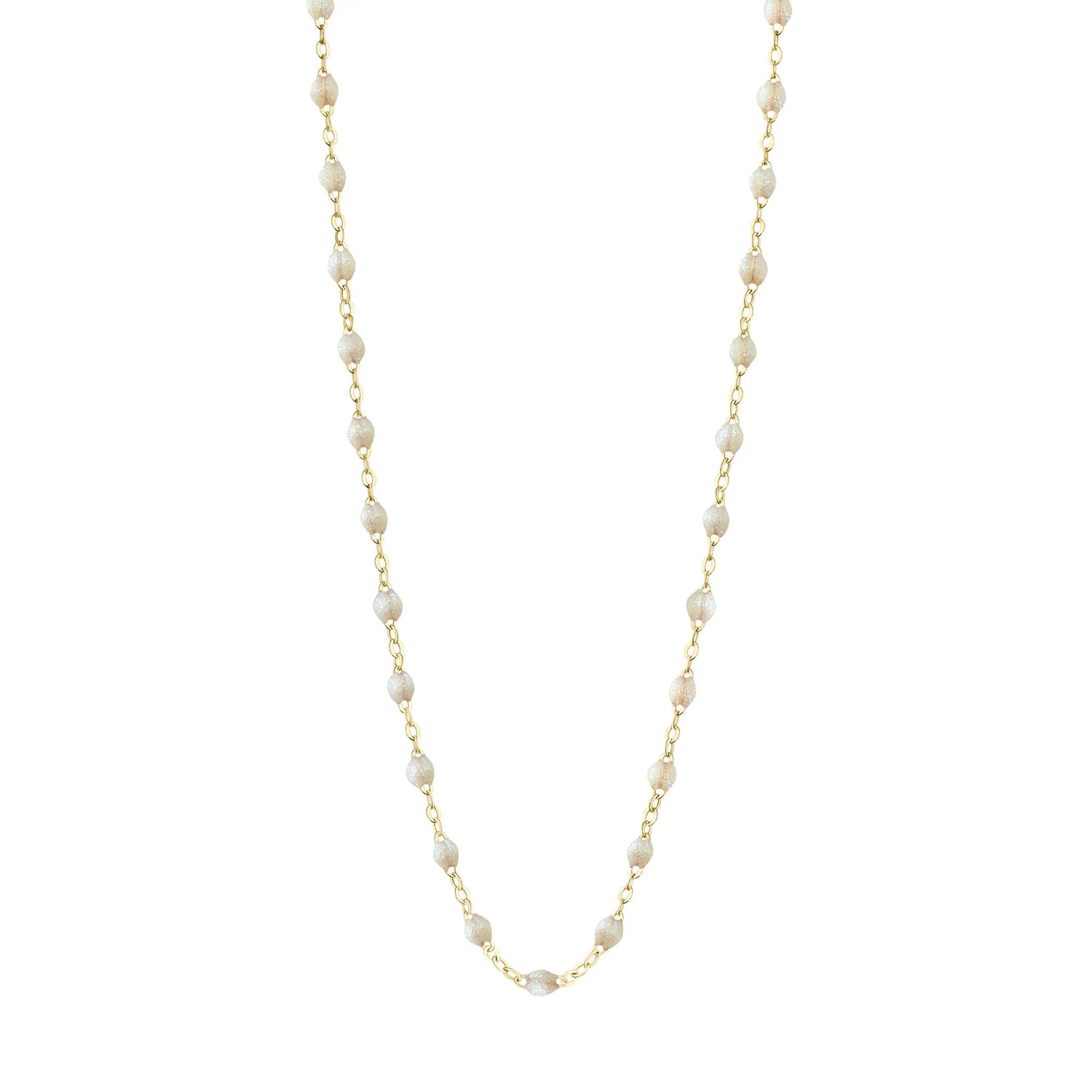 Stack you necklace layers with this versatile beaded chain! The Classic Gigi Necklace by gigi CLOZEAU features 18 carat yellow gold, and striking Opal resin jewels for an everyday effortless appearance. Handcrafted in 18k yellow gold. The beads measure 1.50mm in diameter and is finished with a spring ring clasp. The length is 16.5 inches.