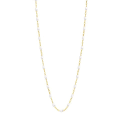 Stack you necklace layers with this versatile beaded chain! The Classic Gigi Necklace by gigi CLOZEAU features 18 carat yellow gold, and striking White resin jewels for an everyday effortless appearance. Handcrafted in 18k yellow gold. The beads measure 1.50mm in diameter and is finished with a spring ring clasp. The length is 16.5 inches.  Each jewel is unique, artisanally made in France in it's family-owned workshop.