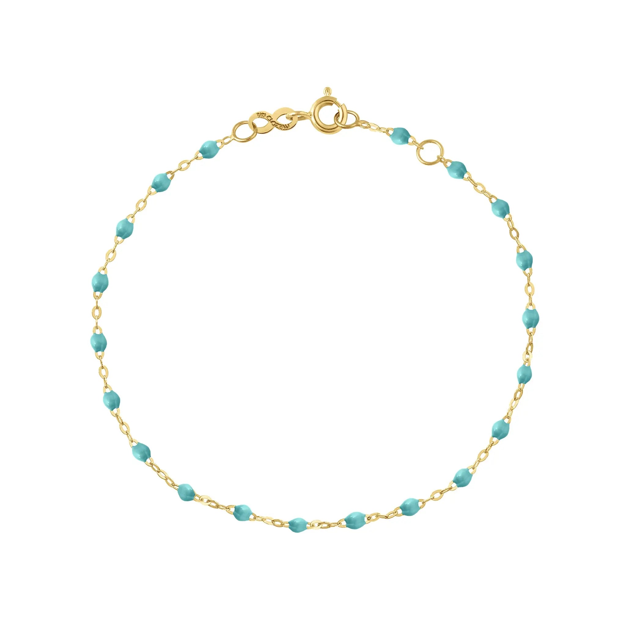 The Classic Gigi bracelet by gigi CLOZEAU features 18K Yellow Gold, and unique Turquoise Green jewels for a simple, everyday look.   Each jewel is unique, artisanally made in their family-owned workshop. 18K yellow gold and resin. The bracelet measures 6.7 inches with adjustable clasp at 6.3 inches.