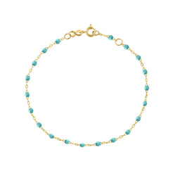 The Classic Gigi bracelet by gigi CLOZEAU features 18K Yellow Gold, and unique Turquoise Green jewels for a simple, everyday look.   Each jewel is unique, artisanally made in their family-owned workshop. 18K yellow gold and resin. The bracelet measures 6.7 inches with adjustable clasp at 6.3 inches.