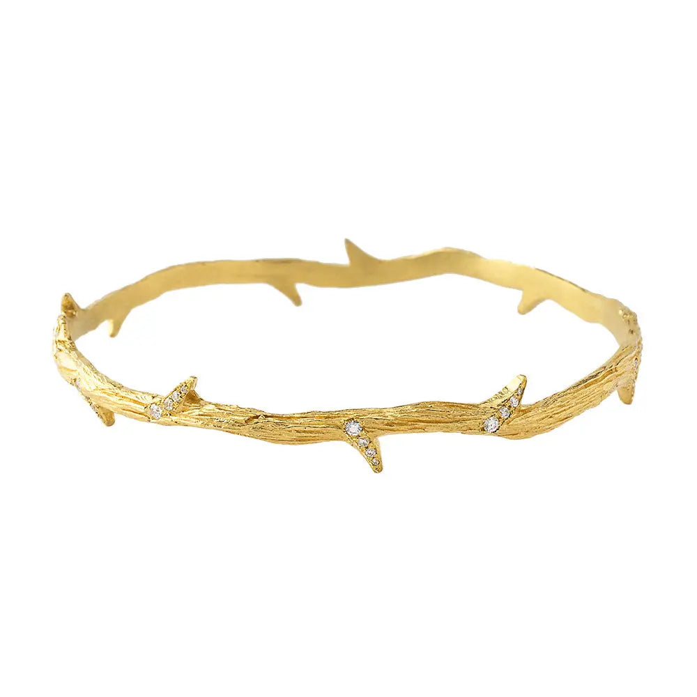18k hinged bangle with organic shape. 21 grams of gold and a half carat of diamonds make a remarkable design a real standout.  Designed by Feral Jewelry