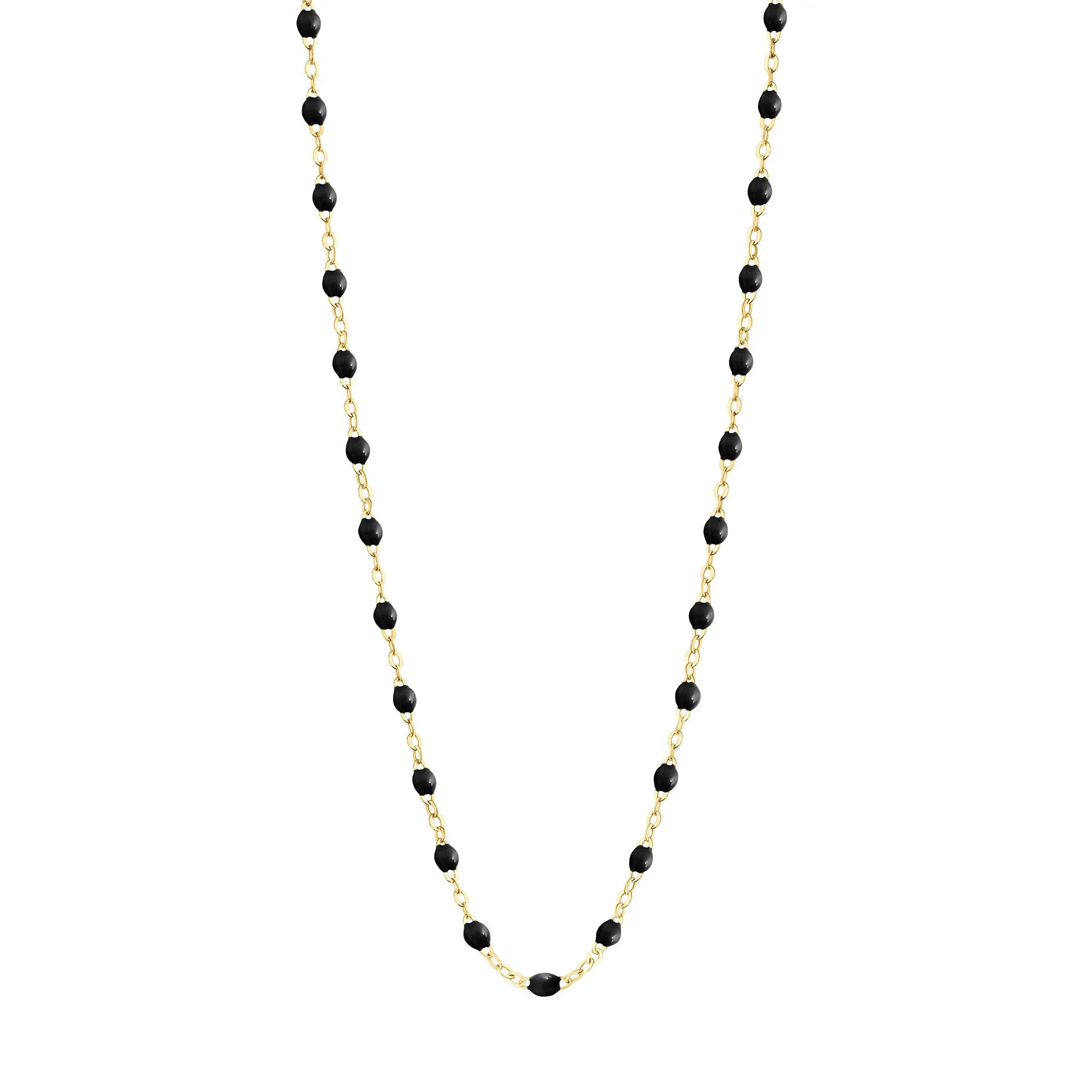 Stack you necklace layers with this versatile beaded chain! The Classic Gigi Necklace by gigi CLOZEAU features 18 carat yellow gold, and striking Black resin jewels for an everyday effortless appearance. Handcrafted in 18k yellow gold. The beads measure 1.50mm in diameter and is finished with a spring ring clasp. The length is 16.5 inches.