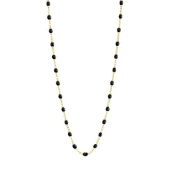 Stack you necklace layers with this versatile beaded chain! The Classic Gigi Necklace by gigi CLOZEAU features 18 carat yellow gold, and striking Black resin jewels for an everyday effortless appearance. Handcrafted in 18k yellow gold. The beads measure 1.50mm in diameter and is finished with a spring ring clasp. The length is 16.5 inches.