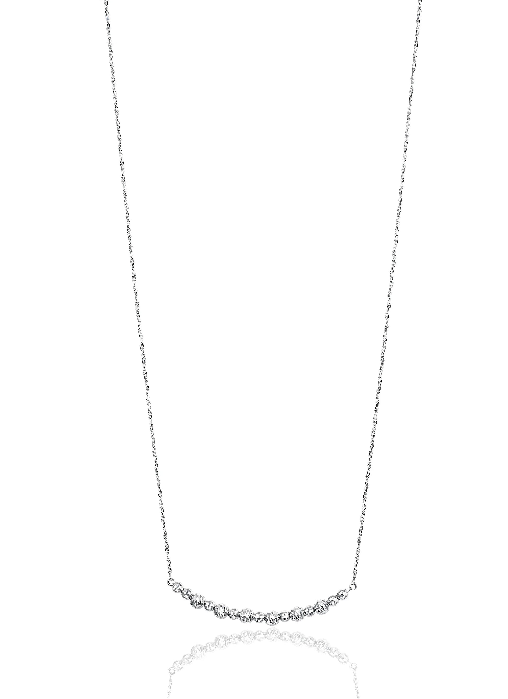 The ultimate timeless classic, Lisette features graduated, brilliant-cut beads threaded by hand into a smile ornament in the center. Held by a delicate, adjustable chain, the Lisette can be lengthened or shortened to wear as a necklace or choker. Designed by Platinum Born