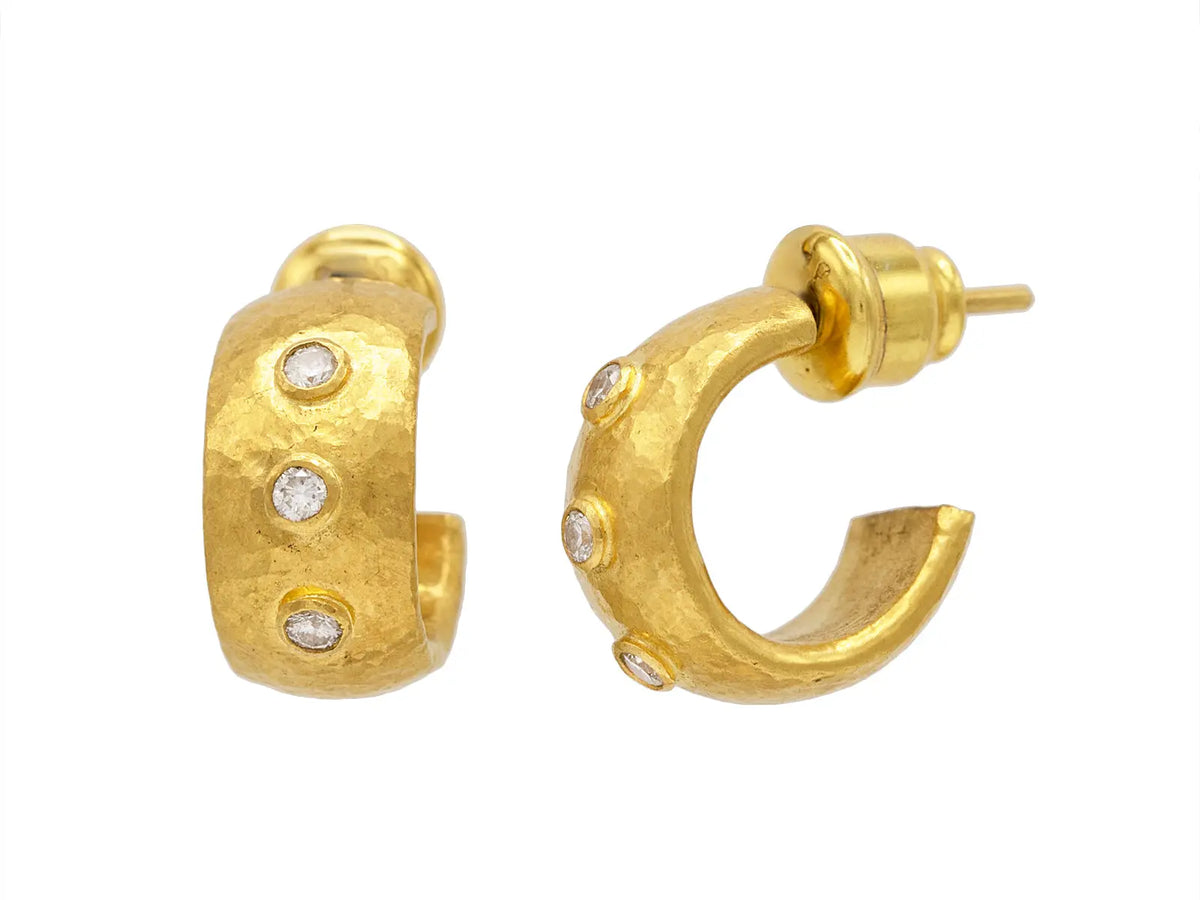 Gurhan Wide Hoop Earrings set in 24k yellow gold. They are from the Droplet Collection. They have 3 round diamonds .18 cttw and the length of the hoops are 0.53 inches.