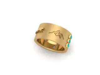 18K yellow gold elements totem band with two emerald baguettes weighing .13ctw, one trillion diamond weighing .04ctw and three 2.0mm turquoise cabs  with mountains, skier, bears and squash blossom elements  Dimoension: 10mm  Ring Size 7  Ask us about customization, email shop@sbvail.com  Designed by Samantha Louise